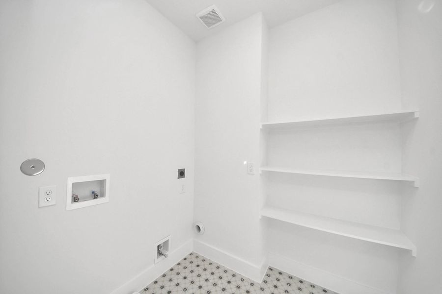 Washer and dryer room with built ins*REPRESENTATIVE PHOTO ONLY. HOME IS UNDER CONSTRUCTION.