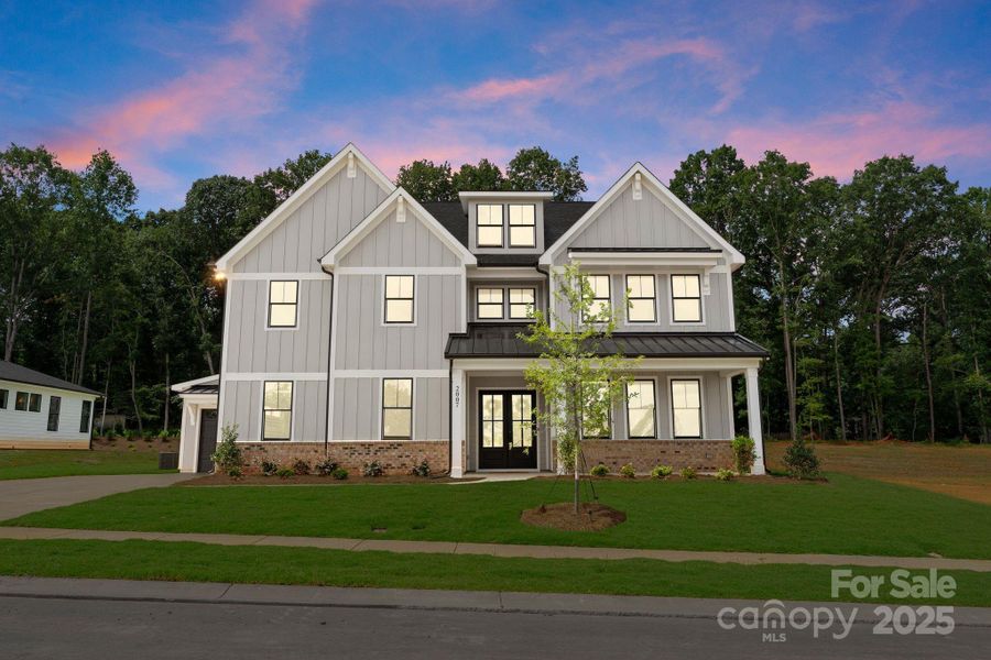 Front exterior of a new home in , Wesley Chapel, NC, highlighting curb appeal (Image 1).