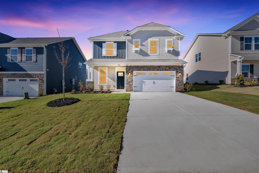 Front exterior of a new home in Halton Oaks, Spartanburg, SC, highlighting curb appeal (Image 16).