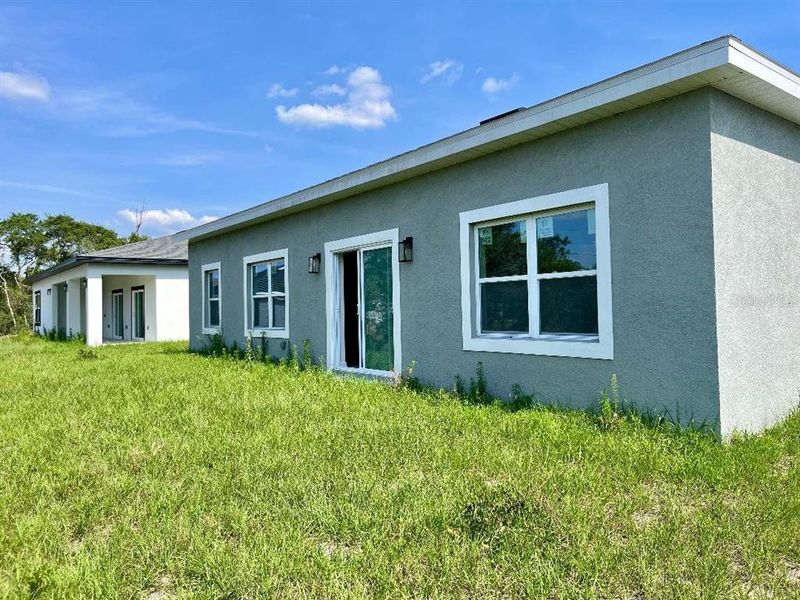 Front exterior of a new home in , Kissimmee, FL, highlighting curb appeal (Image 1). Front exterior of a new home in , Kissimmee, FL, highlighting curb appeal (Image 1).
