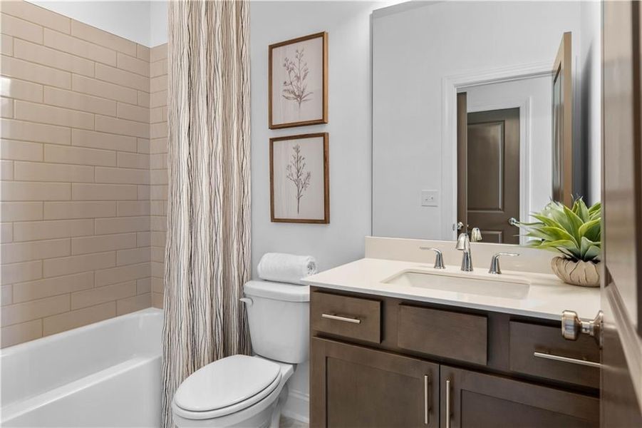 Guest Bedroom #2 Full Bathroom with marble countertops *Images shown are from a decorated model of the same floor plan. Design selections and color packages will vary by home.*