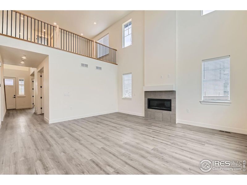 Amazing 2-story Great Room with gas fireplace, open to upstairs loft.