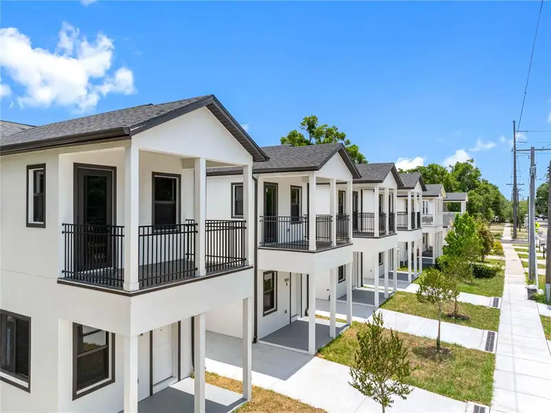 Front exterior of a new home in , Tampa, FL, highlighting curb appeal (Image 23).