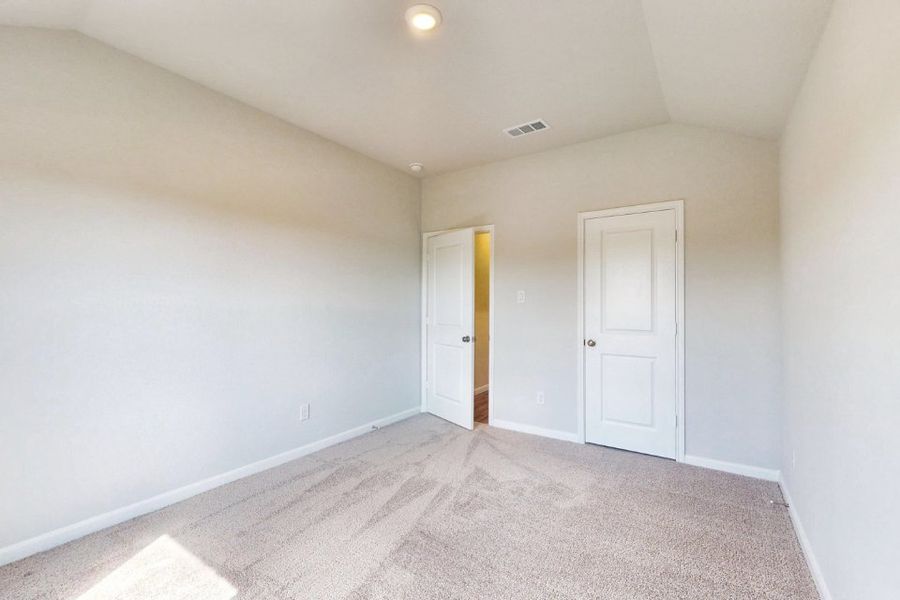 A hallway with white doors. A hallway with white doors.