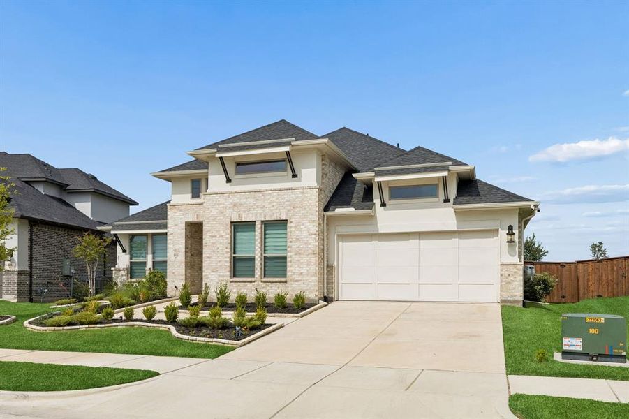 Front exterior of a new home in Dominion of Pleasant Valley, Wylie, TX, highlighting curb appeal (Image 21). Front exterior of a new home in Dominion of Pleasant Valley, Wylie, TX, highlighting curb appeal (Image 21).
