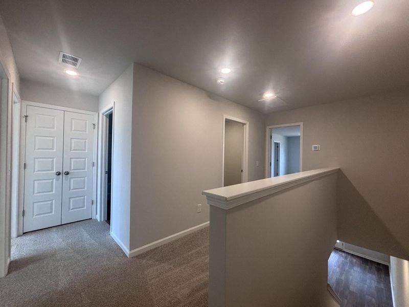 Spacious, unfurnished interior of a new home in Lindera Preserve at Cane Bay Plantation: Townhomes, Summerville (Image 15). Spacious, unfurnished interior of a new home in Lindera Preserve at Cane Bay Plantation: Townhomes, Summerville (Image 15).
