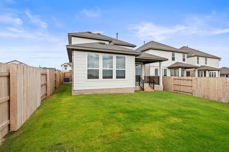 Front exterior of a new home in Terrace Collection at Lariat, Liberty Hill, TX, highlighting curb appeal (Image 26). Front exterior of a new home in Terrace Collection at Lariat, Liberty Hill, TX, highlighting curb appeal (Image 26).