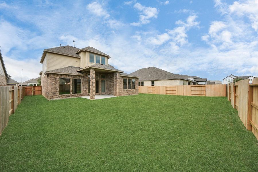 Front exterior of a new home in Marvida, Cypress, TX, highlighting curb appeal (Image 13). Front exterior of a new home in Marvida, Cypress, TX, highlighting curb appeal (Image 13).