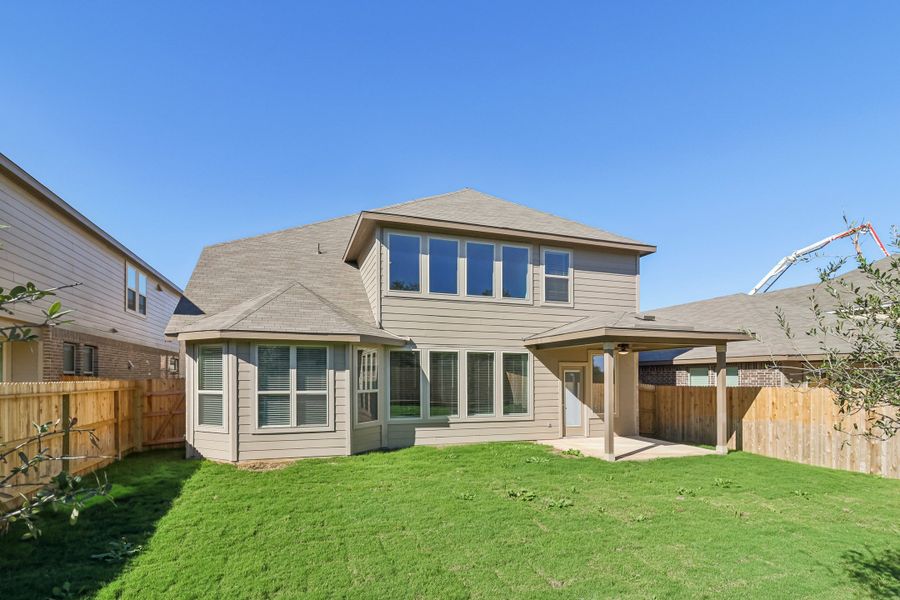 Back exterior of the Cedar floorplan at a Meritage Homes community.