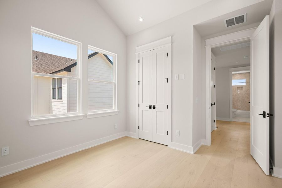 Unfurnished bedroom with light wood finished floors, a closet, and recessed lighting Unfurnished bedroom with light wood finished floors, a closet, and recessed lighting