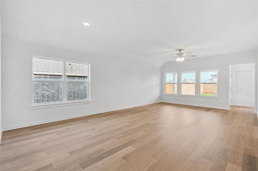 Spare room featuring ceiling fan and light hardwood / wood-style floors