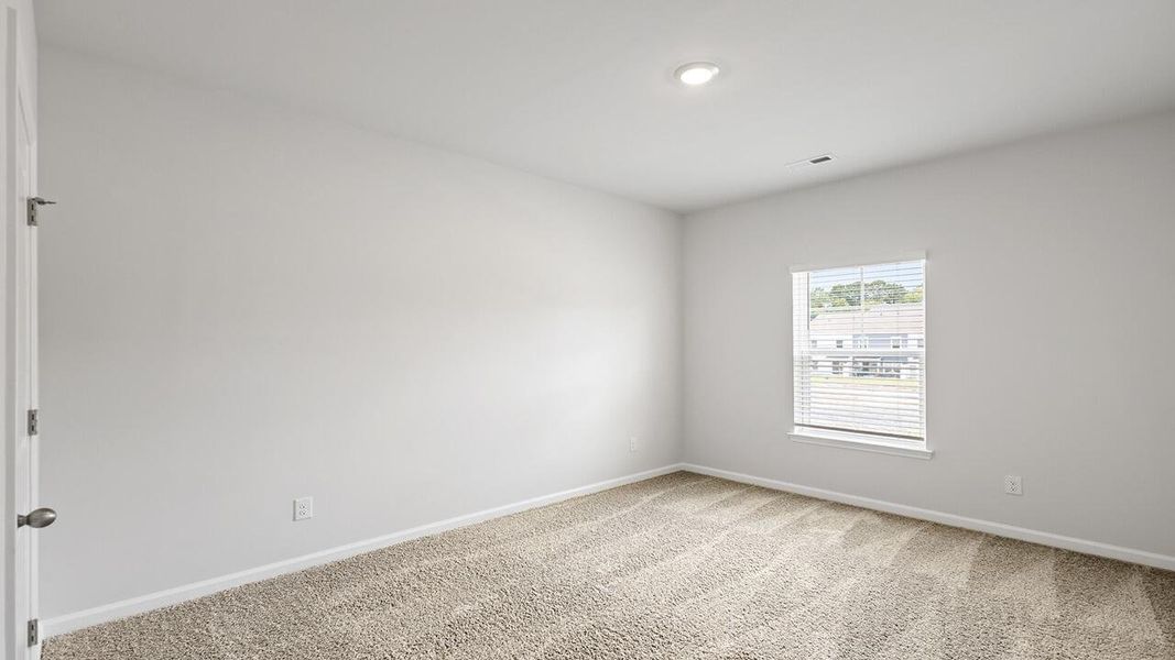 Spacious, unfurnished interior of a new home in The Crossing at St. James, Summerville (Image 17).