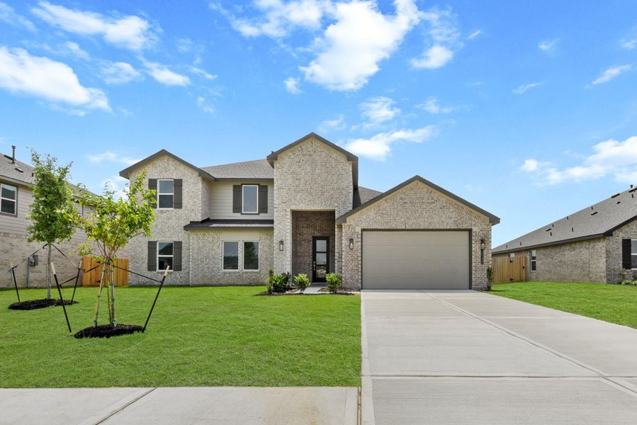 Front exterior of a new home in Riverside Estates, Mont Belvieu, TX, highlighting curb appeal (Image 17).