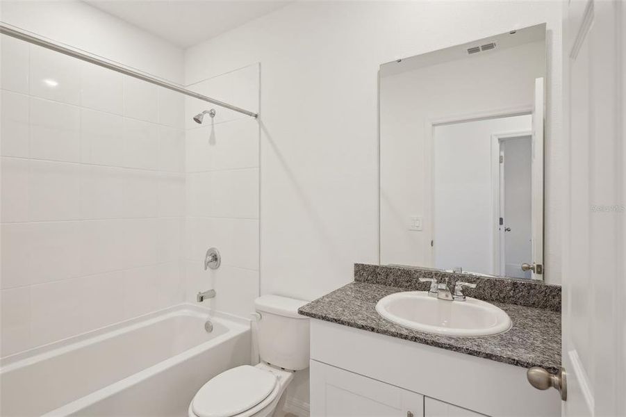 Furnished interior view inside a new home in Lake Deer Estates - Signature Series, Poinciana (Image 11). Furnished interior view inside a new home in Lake Deer Estates - Signature Series, Poinciana (Image 11).