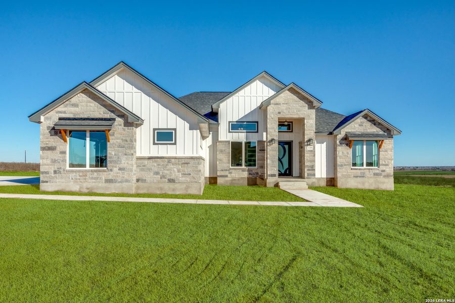 Front exterior of a new home in , La Vernia, TX, highlighting curb appeal (Image 27). Front exterior of a new home in , La Vernia, TX, highlighting curb appeal (Image 27).