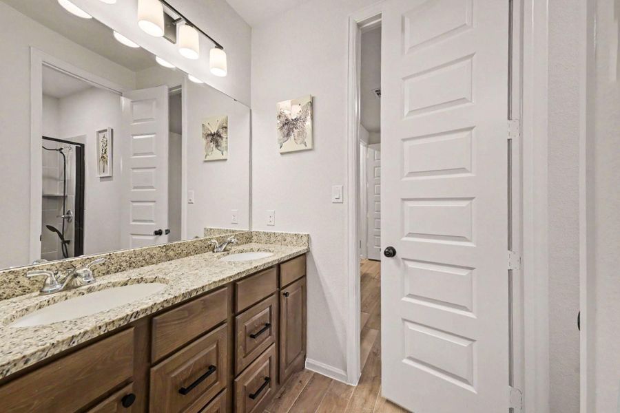Hollywood style bathroom offers dual sinks, and a glass-standing shower. Hollywood style bathroom offers dual sinks, and a glass-standing shower.