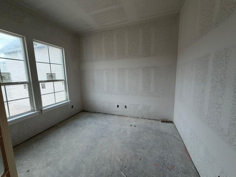 Spare room featuring concrete floors Spare room featuring concrete floors