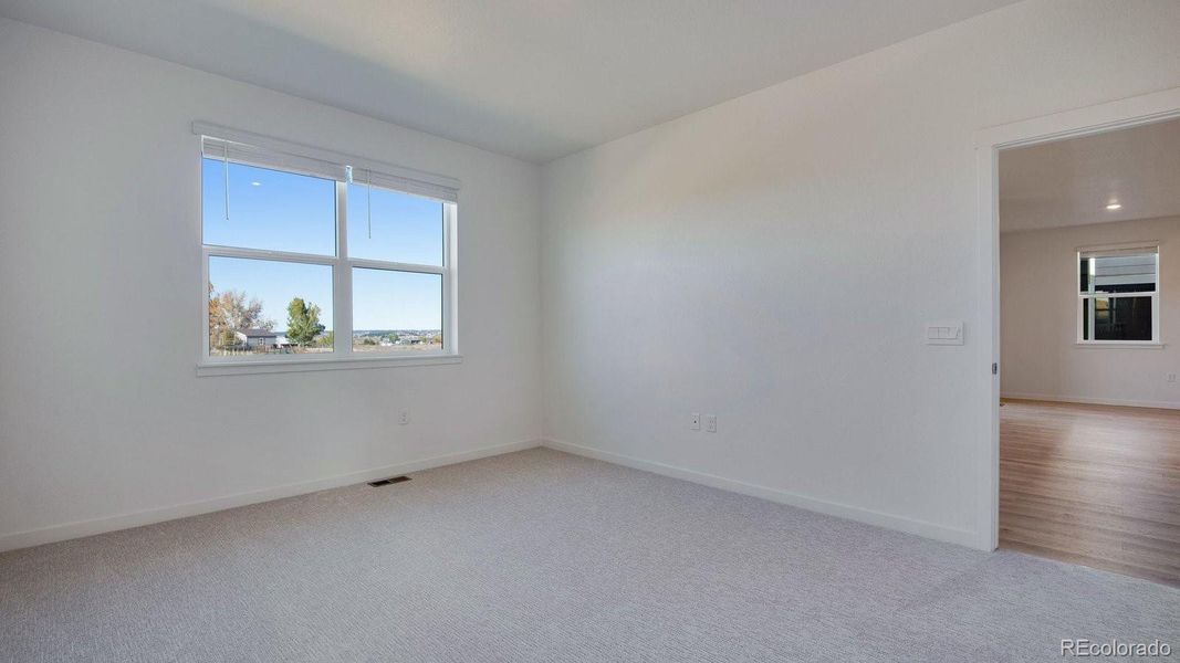 Spacious, unfurnished interior of a new home in Trails at Crowfoot, Parker (Image 25).