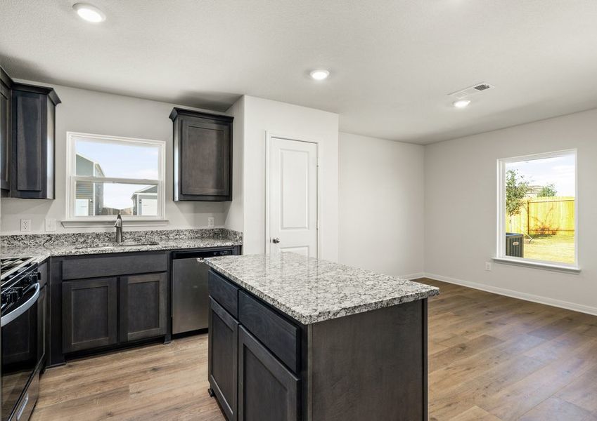The dining room sits right off of the kitchen. The dining room sits right off of the kitchen.