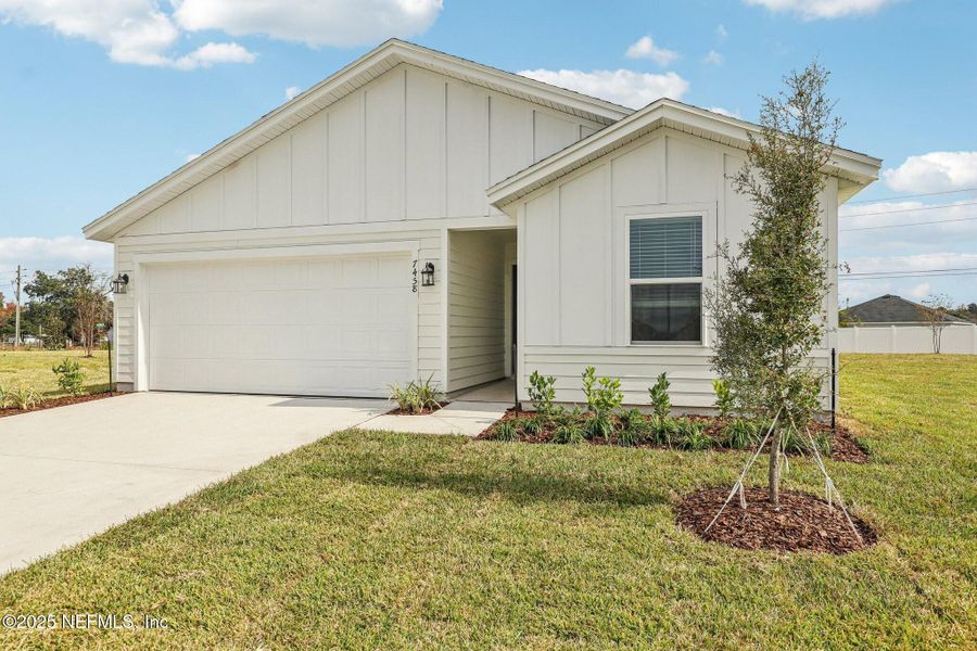 Front exterior of a new home in , Jacksonville, FL, highlighting curb appeal (Image 1).