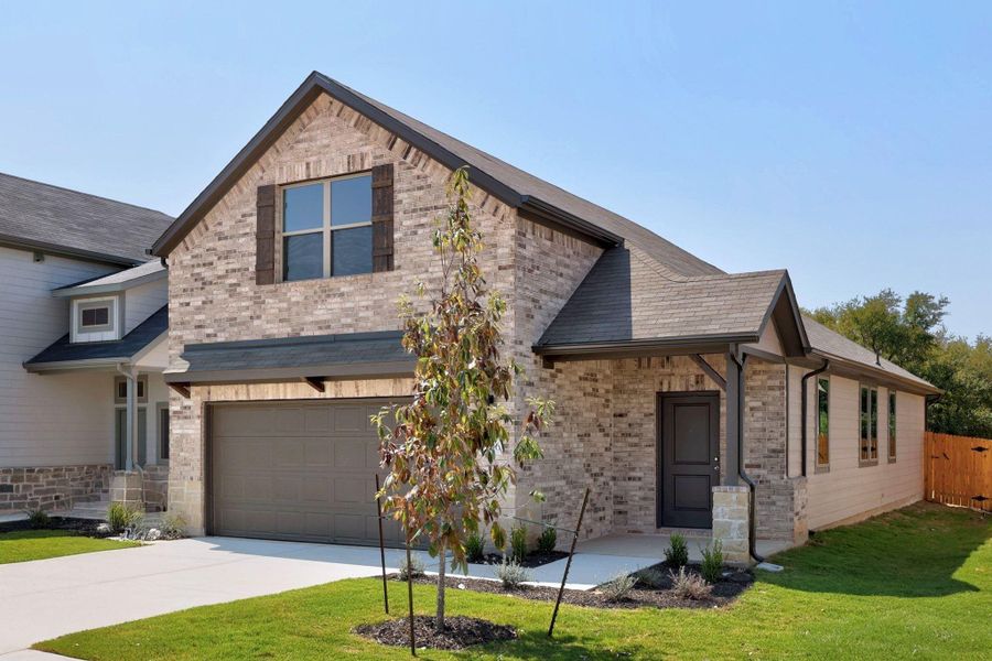 Front exterior of a new home in Trinity Ranch, Elgin, TX, highlighting curb appeal (Image 20).