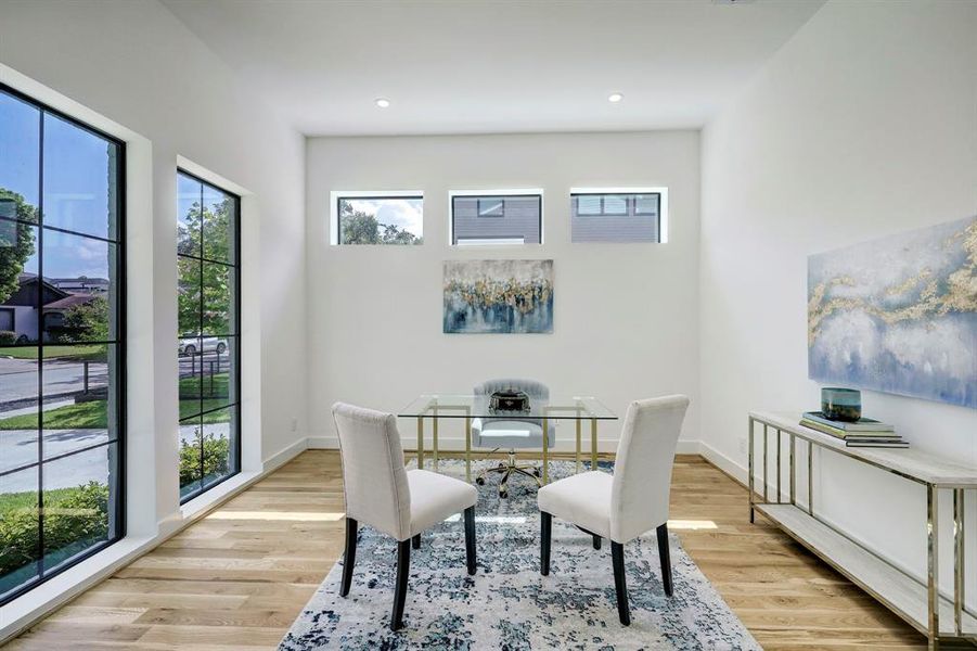 Private home office/study off of entryway with 8 ft. windows for natural light