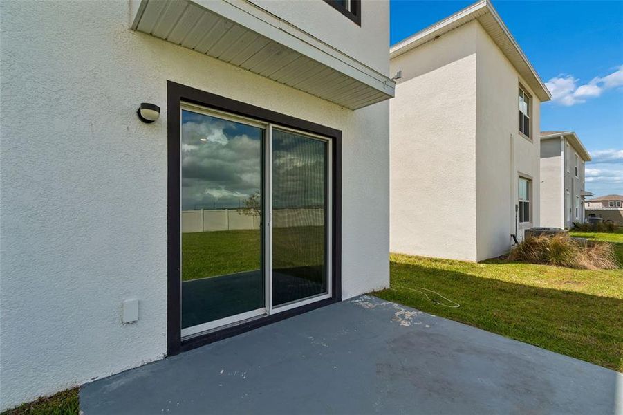 Exterior details and patio area of a home in Epperson, Wesley Chapel (Image 31).