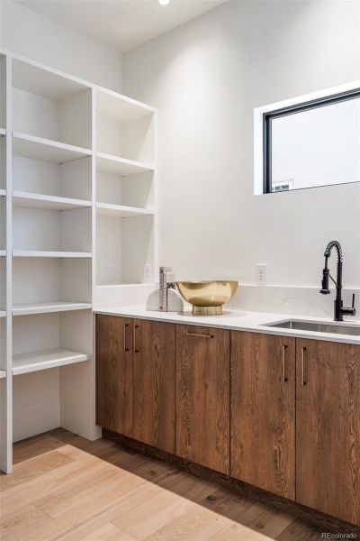A separate pantry and sink space for prep