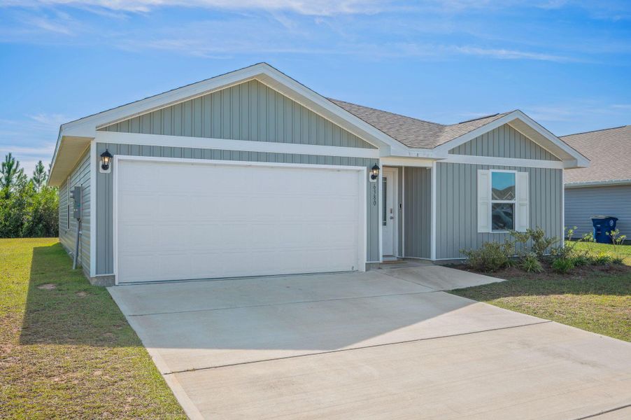 Front exterior of a new home in , Panama City, FL, highlighting curb appeal (Image 1).