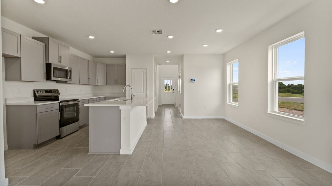 The Naples Kitchen with large Island Quick Move-In Home at Willowbrook North by DRB Homes in Winter Haven, FL The Naples Kitchen with large Island Quick Move-In Home at Willowbrook North by DRB Homes in Winter Haven, FL