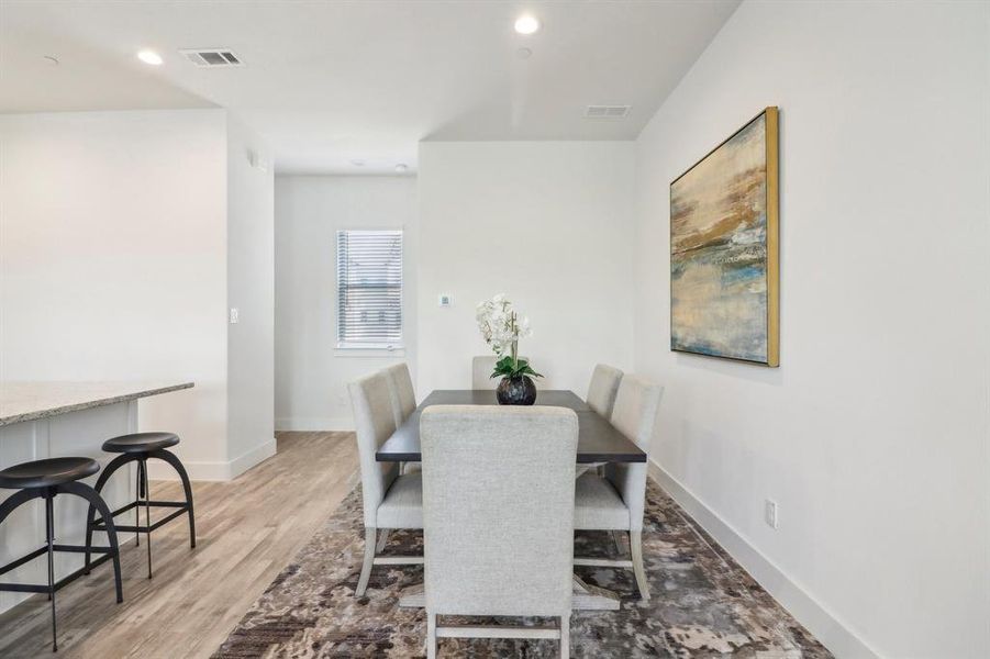 Dining space with light wood-type flooring