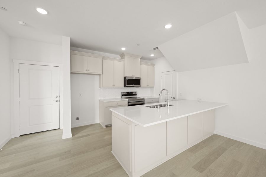Furnished interior view inside a new home in Wildridge, Oak Point (Image 7).