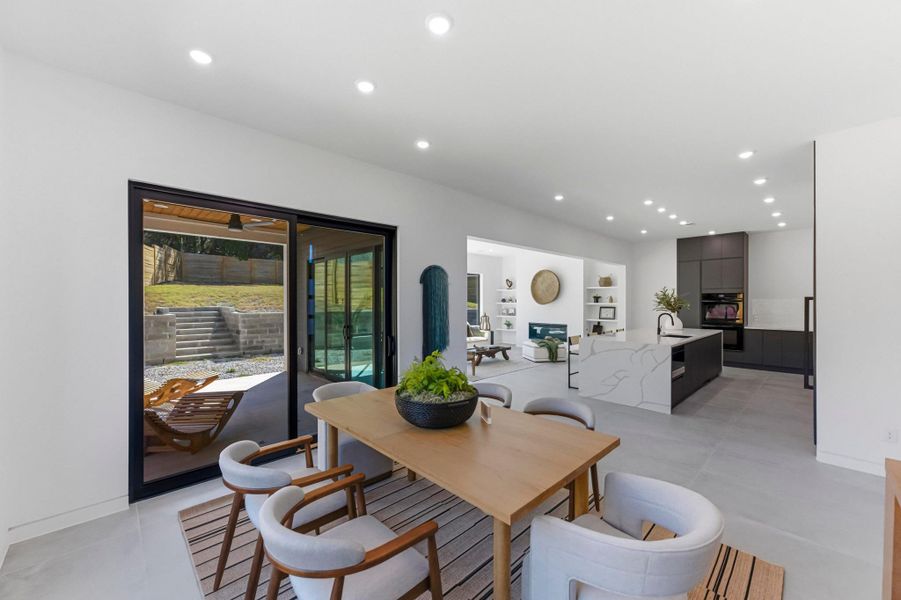 Dining space with recessed lighting and baseboards