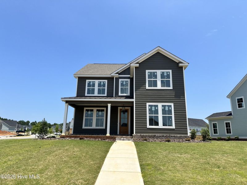Front exterior of a new home in Highland Lakes, Evans, GA, highlighting curb appeal (Image 1). Front exterior of a new home in Highland Lakes, Evans, GA, highlighting curb appeal (Image 1).