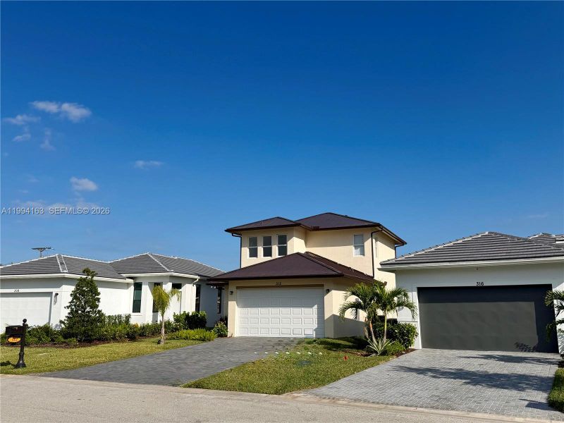 Front exterior of a new home in , Port St. Lucie, FL, highlighting curb appeal (Image 29).