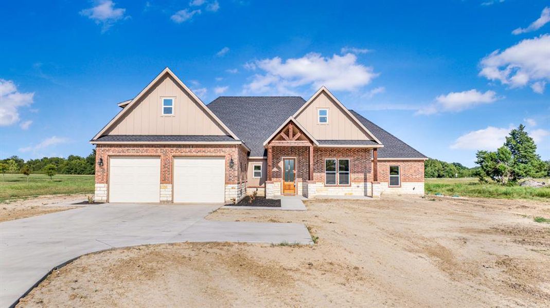 Front exterior of a new home in , Greenville, TX, highlighting curb appeal (Image 2). Front exterior of a new home in , Greenville, TX, highlighting curb appeal (Image 2).