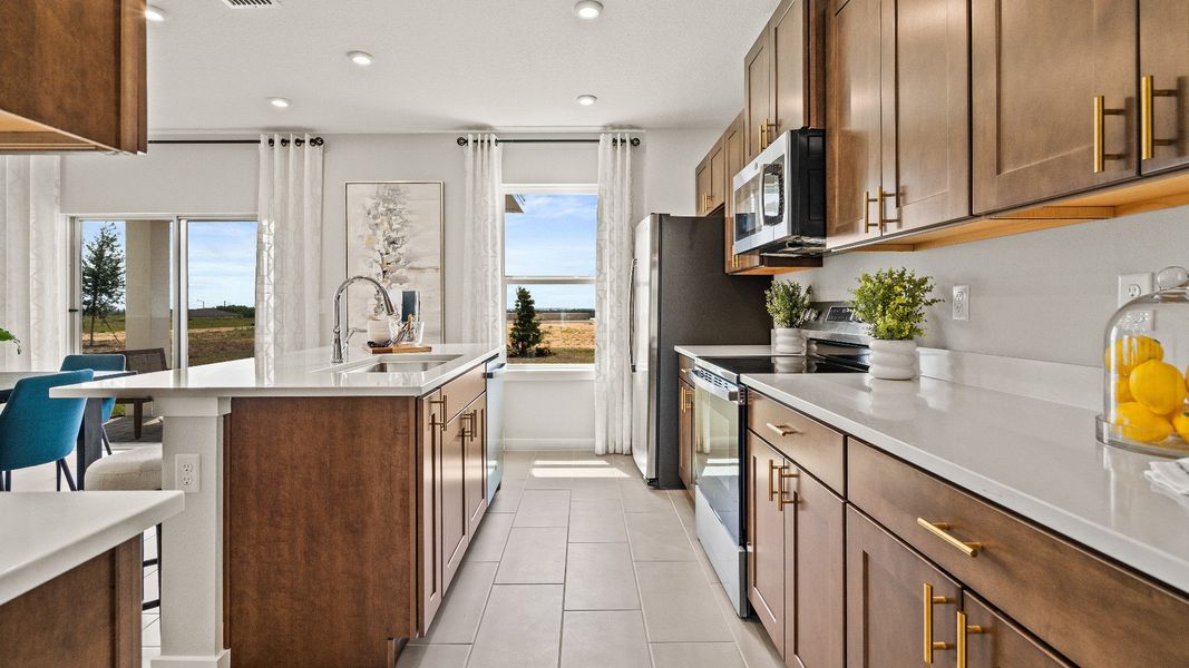 The Kitchen in the Model Highbourne by DRB Homes in Hamilton Bluff located in Haines City, FL. The Kitchen in the Model Highbourne by DRB Homes in Hamilton Bluff located in Haines City, FL.