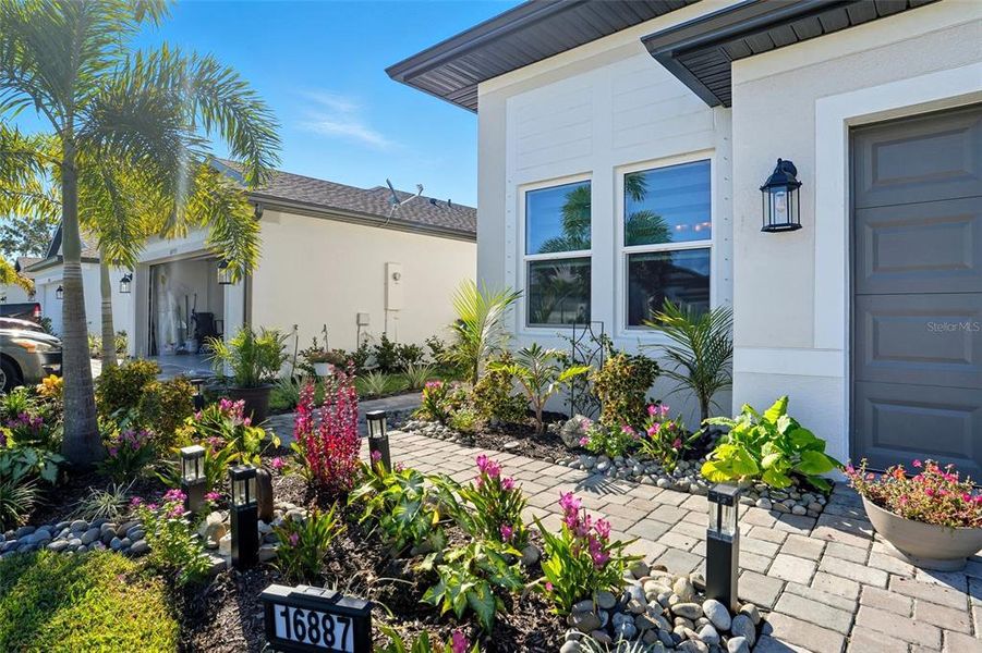 Front exterior of a new home in , Port Charlotte, FL, highlighting curb appeal (Image 24). Front exterior of a new home in , Port Charlotte, FL, highlighting curb appeal (Image 24).