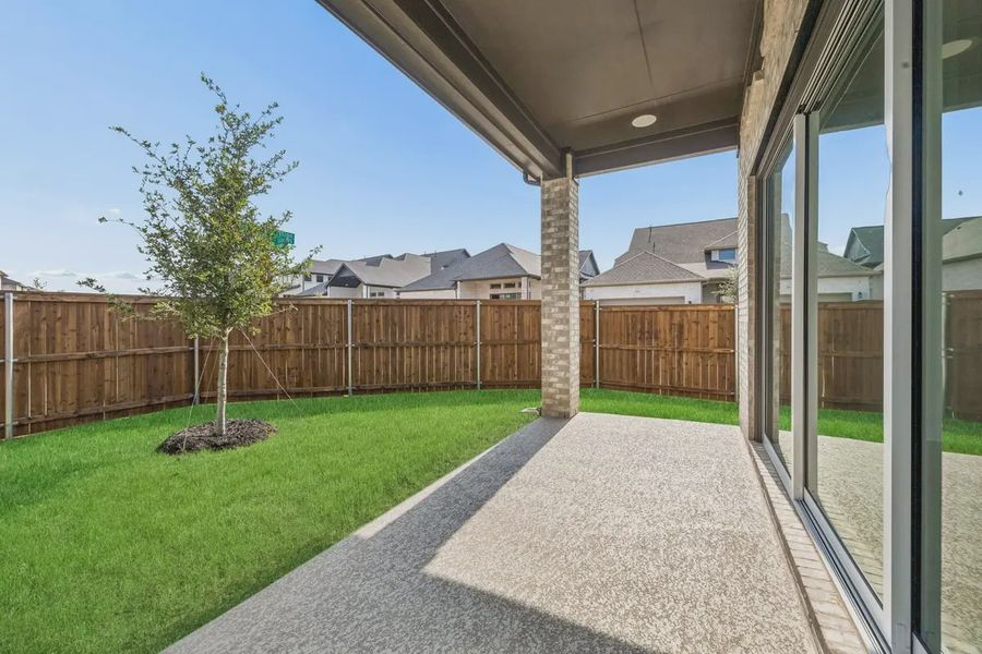 Exterior details and patio area of a home in The Grove Frisco, Frisco (Image 17).