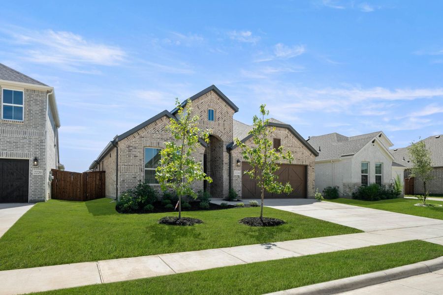 Front exterior of a new home in Discovery Collection at Bridgewater, Midlothian, TX, highlighting curb appeal (Image 2).