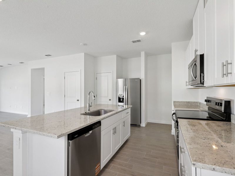 Furnished interior view inside a new home in Lakes at Bella Lago - Classic Series, Green Cove Springs (Image 4).