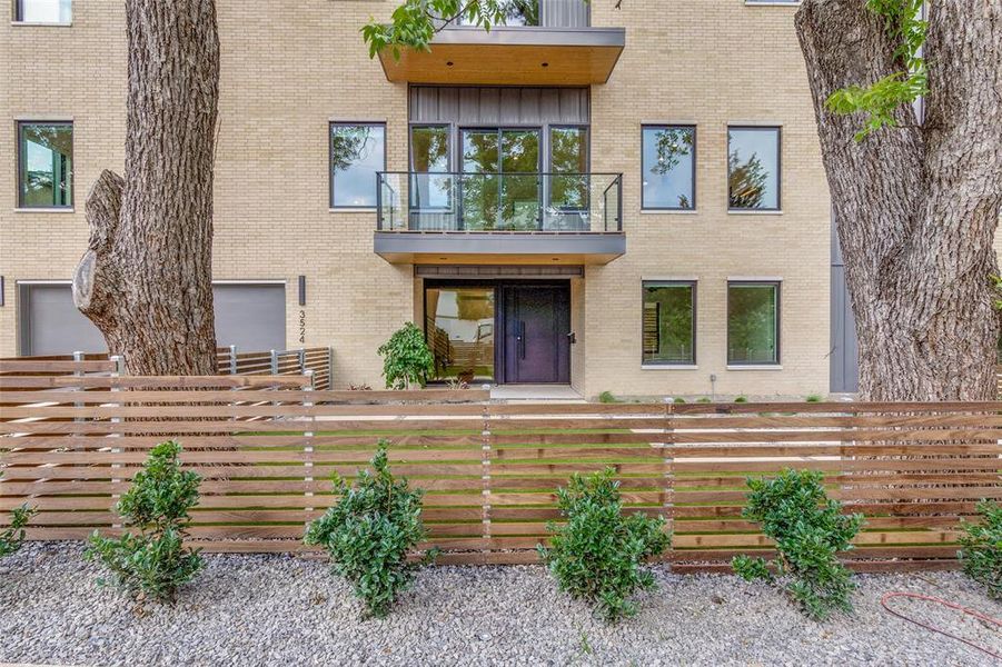 Private fenced front yard and patio