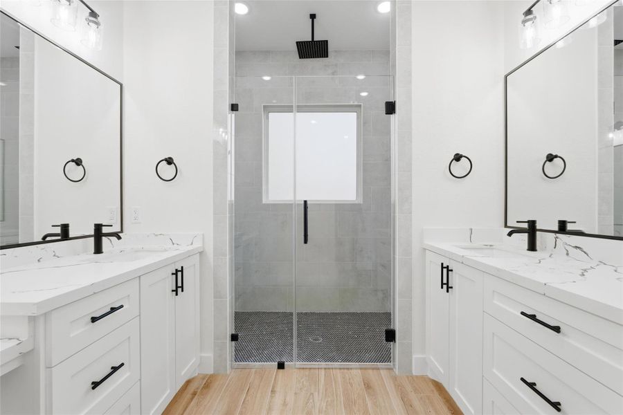 Primary bath of your dreams! A huge shower big enough for 2, separate sinks and plenty of storage!