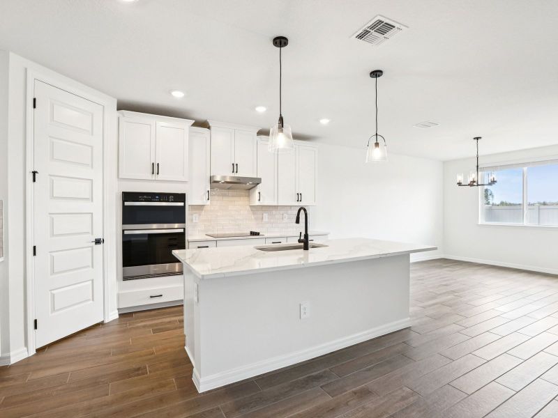 Furnished interior view inside a new home in Oakfield Trails - Signature Series, Parrish (Image 3).