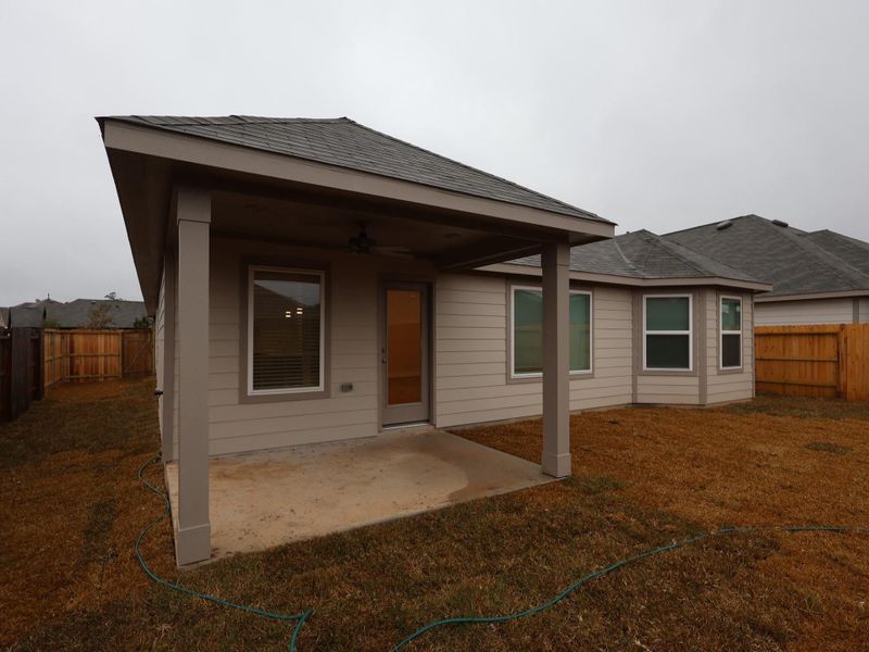 Exterior details and patio area of a home in Pinewood at Grand Texas, New Caney (Image 3).