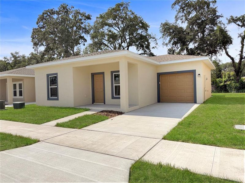 Front exterior of a new home in , Tampa, FL, highlighting curb appeal (Image 1). Front exterior of a new home in , Tampa, FL, highlighting curb appeal (Image 1).