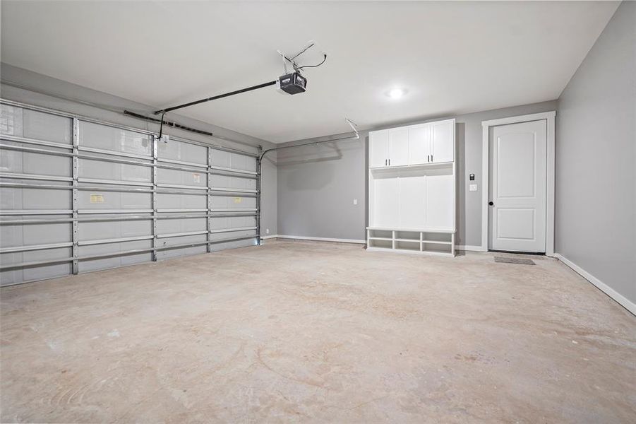 Large two car garage with a great built-in mud area.