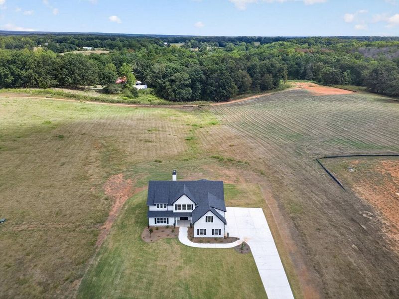 Front exterior of a new home in Blackwelder Bluff, Bowdon, GA, highlighting curb appeal (Image 33).