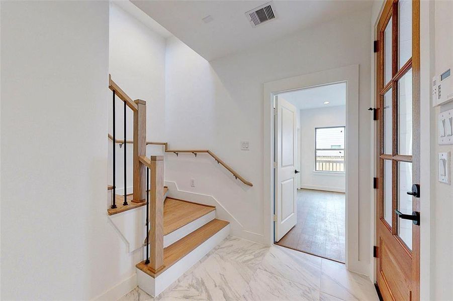 Entryway on first floor.Photos of similar completed home by same builder. Selections may differ.