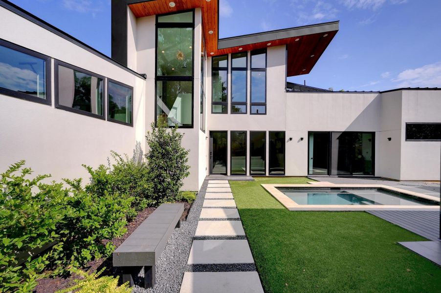 Front exterior of a new home in , Austin, TX, highlighting curb appeal (Image 1). Front exterior of a new home in , Austin, TX, highlighting curb appeal (Image 1).